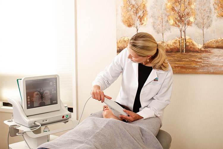 Patient with device sculpting her buttocks