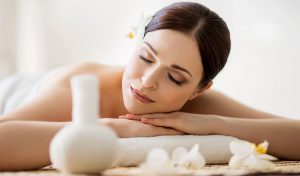 Woman lying on her stomach with serene appearance