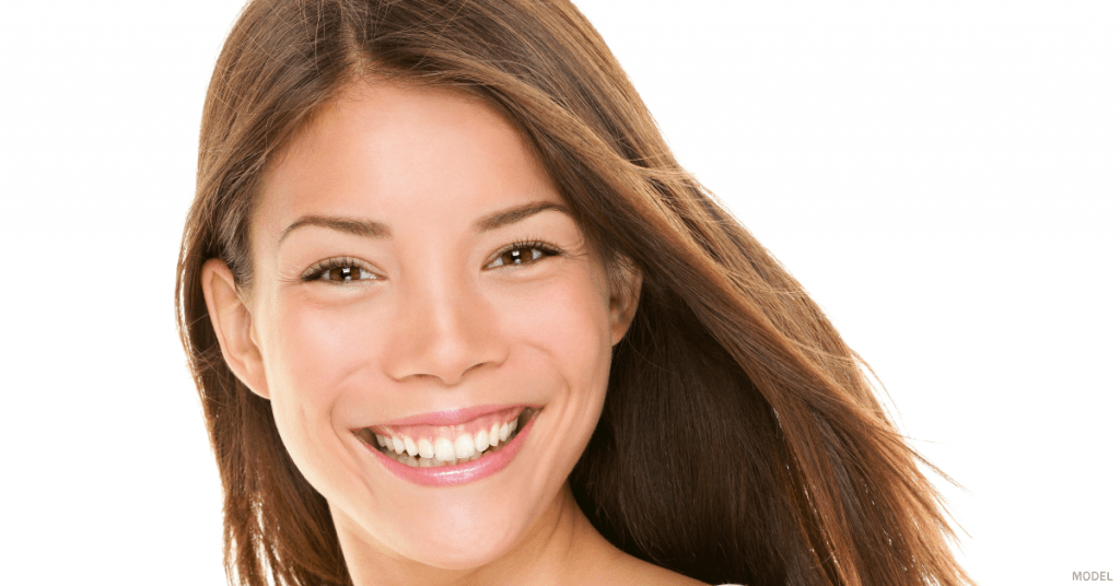A woman in Rochester, NY is happy with her laser treatment and summertime glow.
