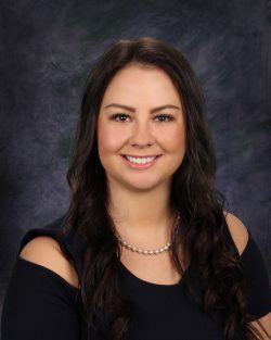 Nurse practitioner Brittane Fetterman smiles at the camera.