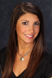 Nicole Frasca-Trinkl smiles at camera. She is a manager and cosmetologist for the DermSpa