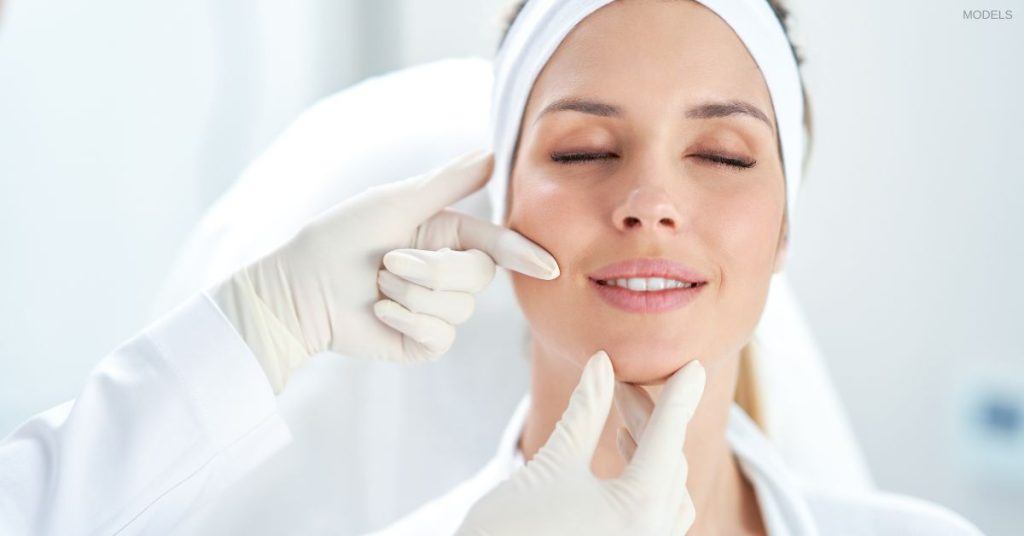 Woman having her face examined by a doctor (models) prior to receiving BOTOX® Cosmetic injections.